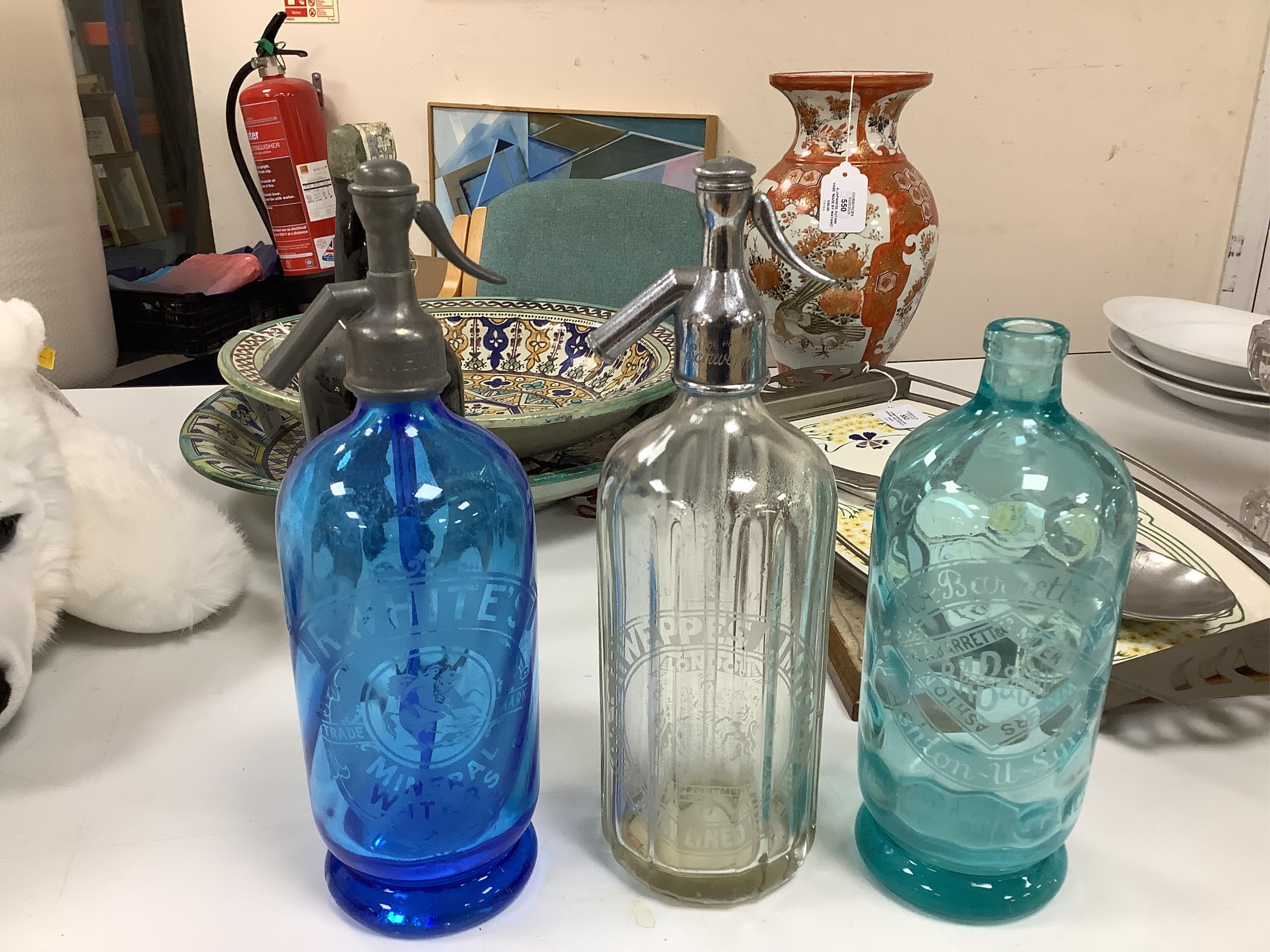 An Edwardian Standard English Seltzogenes double gourd Soda Syphon, one other and a collection of coloured glass bottles. Condition - varies